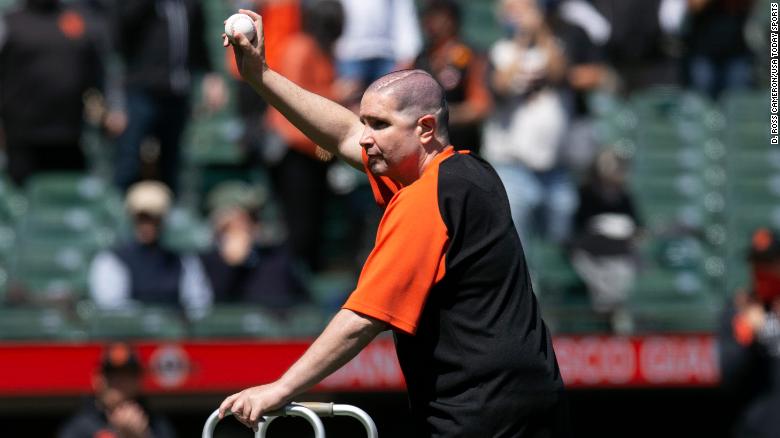Giants fan throws traditional first pitch 10 years after a near-fatal outbreak