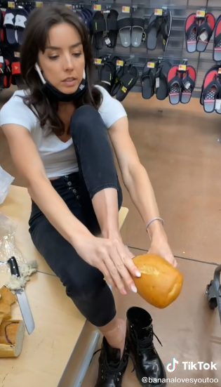 Screenshot from the video of anna russ wearing the bread shoe on her TikTok account